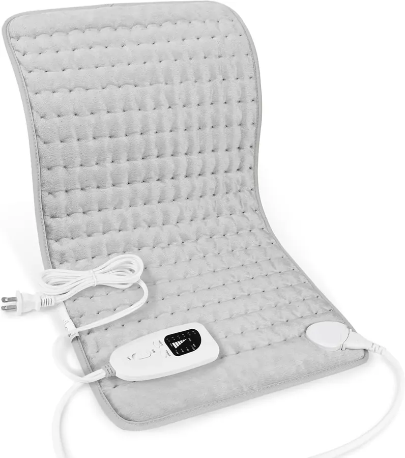 Small damp sponge insert being placed into the pocket of a heating pad before use